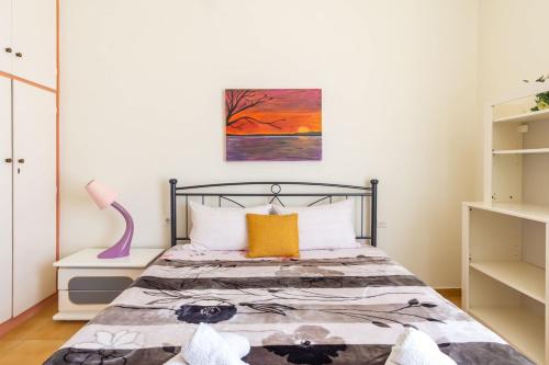 Posteľ alebo postele v izbe v ubytovaní Mema's Tranquil Apartment in Patra