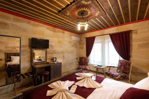 Postel nebo postele na pokoji v ubytování Volare Stone Hotel