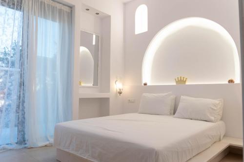 Säng eller sängar i ett rum på Villa Iliousa Princess