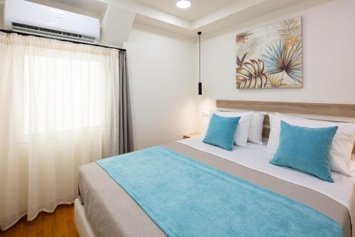 Posteľ alebo postele v izbe v ubytovaní Sun Moon Apartments