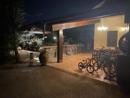 a group of bikes parked outside of a building at night at Agriturismo San Michele in San Michele