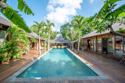 an image of a swimming pool in a villa at Secret River Villa in Kerobokan