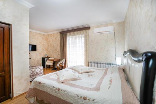 Postel nebo postele na pokoji v ubytování Natali Hotel