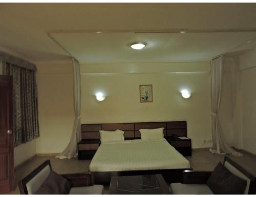 Postel nebo postele na pokoji v ubytování Sky Hotel Nairobi