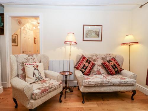 a living room with two chairs and a couch at 138D Old Star & Garter Mews in Ludlow