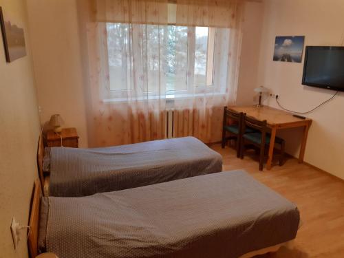 Voodi või voodid majutusasutuse Jõesuu Home Accommodation toas