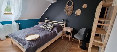 Posteľ alebo postele v izbe v ubytovaní Apartament w centrum - Nasze poddasze