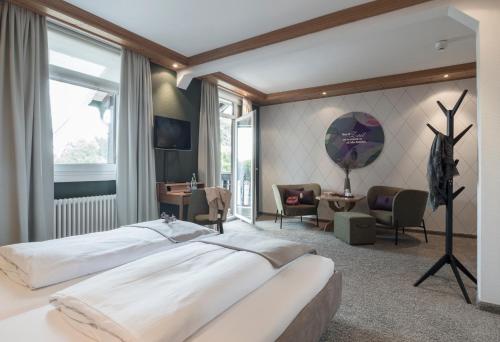 Postel nebo postele na pokoji v ubytování Hotel Schwarzwaldhof