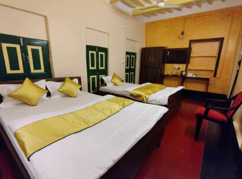 Postel nebo postele na pokoji v ubytování Tulin Heritage Bungalow - Purulia