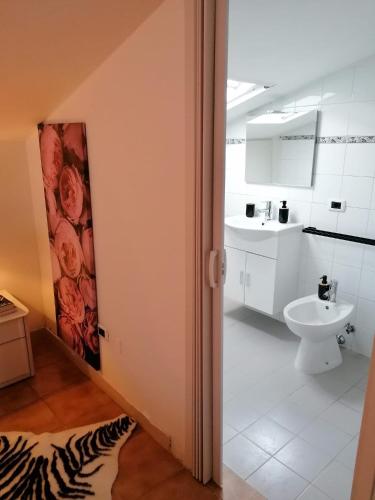 a bathroom with a toilet and a sink at Bramante-12 in Pescara