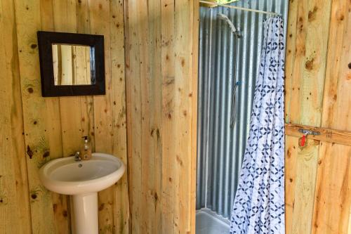 a bathroom with a sink and a mirror at Finest Retreats - Ash Lotus Belle Tent in Ilfracombe