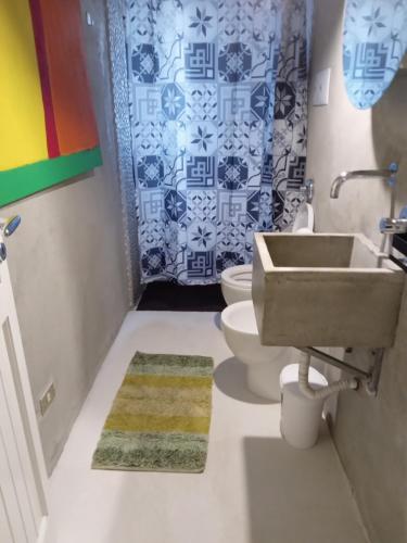 a bathroom with a sink and a toilet at Casa Vacanze La Tonnara in San Giorgio