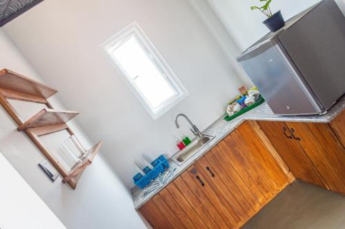 a kitchen with a sink and a window at Western sky in Negombo