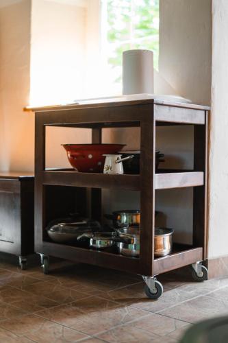 a kitchen cart with pots and pans on it at Country House Sveta Ana in Stari Trg pri Ložu