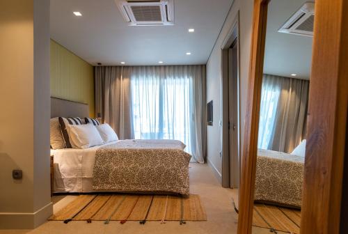 Ένα ή περισσότερα κρεβάτια σε δωμάτιο στο Coocono Villas