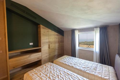 Postel nebo postele na pokoji v ubytování Eremus Relais