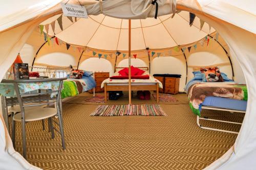 a room with two beds in a tent at Finest Retreats - Oak Lotus Belle Tent in Ilfracombe