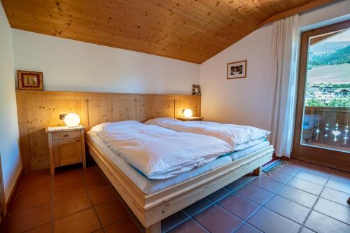 Una cama o camas en una habitación de Apartment Mitterdorfer
