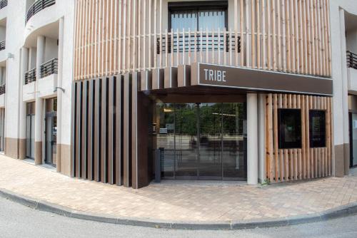 a store front with the entrance to a building at Tribe Carcassonne in Carcassonne