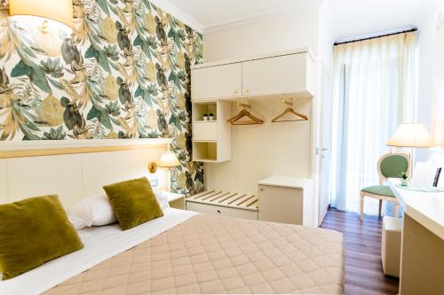 Postel nebo postele na pokoji v ubytování Hotel Corso