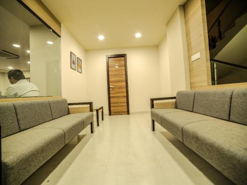 a man sitting in a waiting room at The Basil Park in Bhavnagar