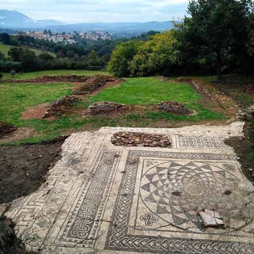 a mosaic floor on a hill with a city in the background at Hotel Ristorante Aeclanum in Mirabella Eclano