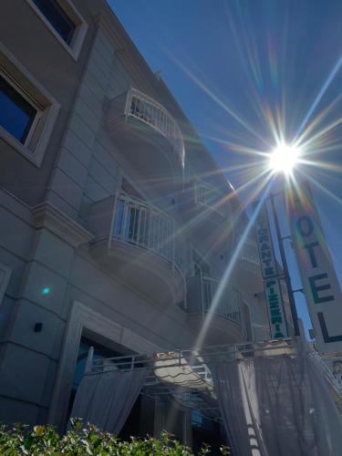 a building with a sun shining on the side of it at Hotel Ristorante Aeclanum in Mirabella Eclano