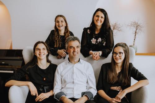 a group of people sitting on a couch at Tonzhaus Hotel in Senales