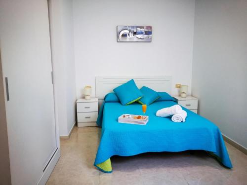 A bed or beds in a room at Puesta de Sol Rentals 2BR