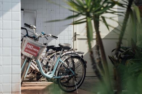 a group of bikes parked next to a building at 5963 Turn Right B&B in Jiaoxi