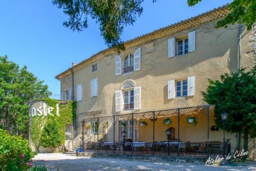 a building with a sign in front of it at Peaceful retreat in Drome Provencale Castel in Montboucher-sur-Jabron