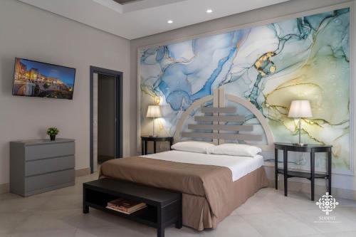 a bedroom with a large bed and a painting on the wall at Matteotti Luxury Residence in Siracusa