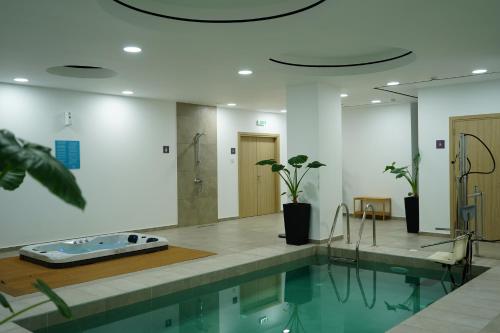 The swimming pool at or close to Caramela Luxury Apts
