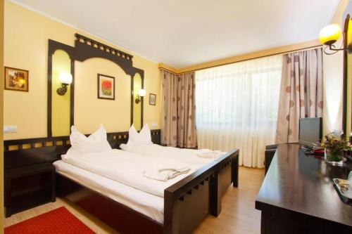 Ένα ή περισσότερα κρεβάτια σε δωμάτιο στο Pensiunea Iulia Star