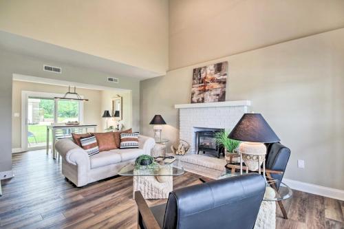 a living room with a couch and a fireplace at Stunning Townhome about 5 Mi to Dtwn Columbia! in Columbia