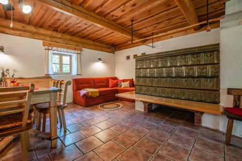 a living room with a couch and a table at Boutique House Vresje in Bohinjska Bistrica