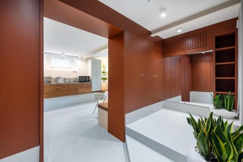 a kitchen and dining room with wood paneling at Villa Fedora Luxury Suites in Lucca