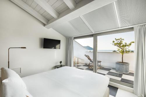 Postel nebo postele na pokoji v ubytování SeeBay Hotel