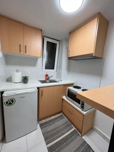 A kitchen or kitchenette at Your studio Athens