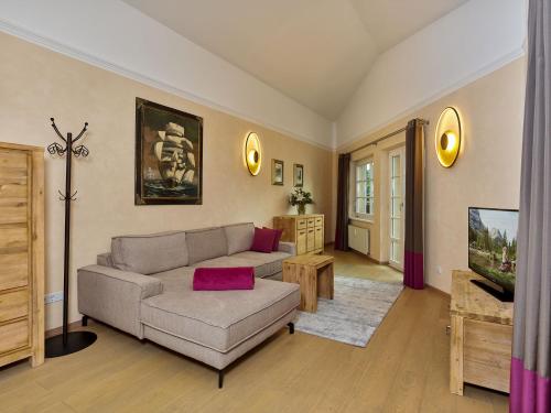 a living room with a couch and a table at A-VITA Viktoria & A-VITA living luxury apartments in Seefeld in Tirol