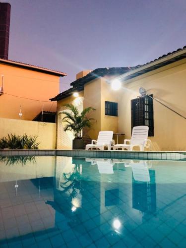Hospedagem domiciliar Transfer (aeroporto) Viagem Sustentável - Nível 1 Pousada Casa Ikena Menor preço em Hospedagem domiciliar Transfer (aeroporto) Viagem Sustentável - Nível 1 Pousada Casa Ikena