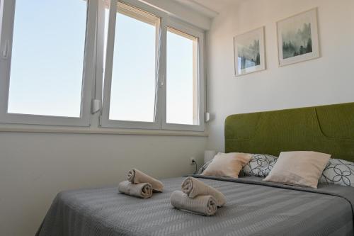 Posteľ alebo postele v izbe v ubytovaní Apartman ARMANDO
