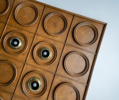 a wooden table with circles on it at Bridges Residence in Veliko Tŭrnovo
