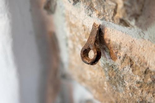 an old rusty hook on a brick wall at Bridges Residence in Veliko Tŭrnovo