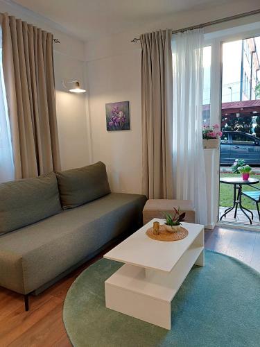 a living room with a couch and a coffee table at Iris Guesthouse in Ohrid