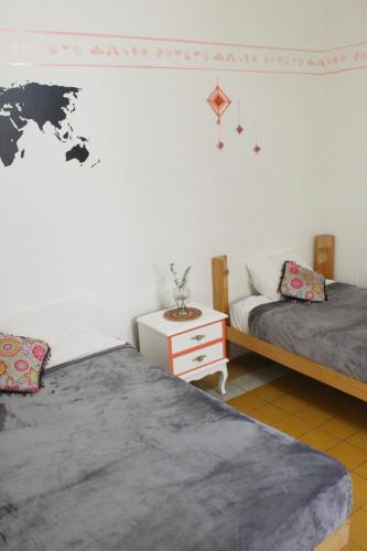 Postel nebo postele na pokoji v ubytování Hostal Casa Colores Adults Only