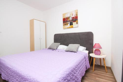 Posteľ alebo postele v izbe v ubytovaní Apartments Lotta