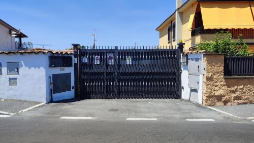 a black gate in the middle of a street at Casa Vacanza Giorgia in Marino