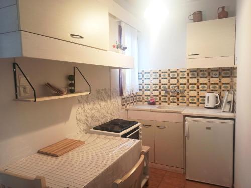 Kjøkken eller kjøkkenkrok på Papadioti Apartments
