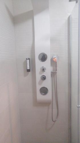 a bathroom with a shower with a glass door at Cozy Condo Rovinj in Rovinj